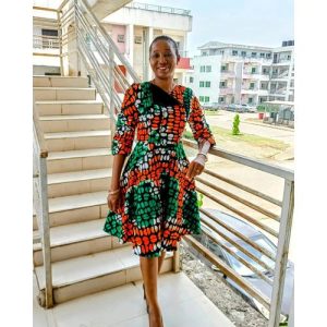 Elegant Ankara Midi Dress with Lace Detail and Ruched Sleeves