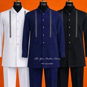 The Onyx & Royal Trio A collection of long-sleeved tunics and matching trousers featuring intricate Greek-key inspired embroidery along the placket.