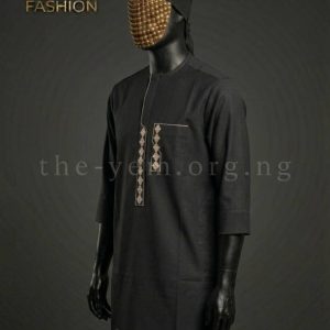 A minimalist, deep navy kaftan featuring a sharp, cream geometric overlay and a clean concealed placket.