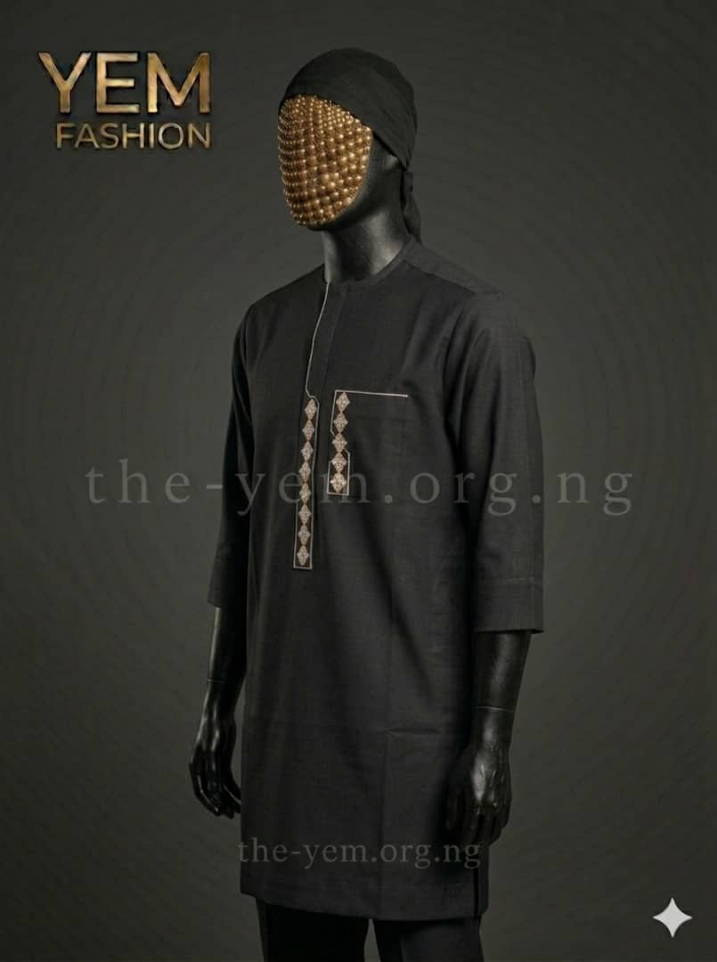 A minimalist, deep navy kaftan featuring a sharp, cream geometric overlay and a clean concealed placket.